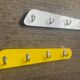 Duo of asymmetrical Formica coat racks from the 60s
