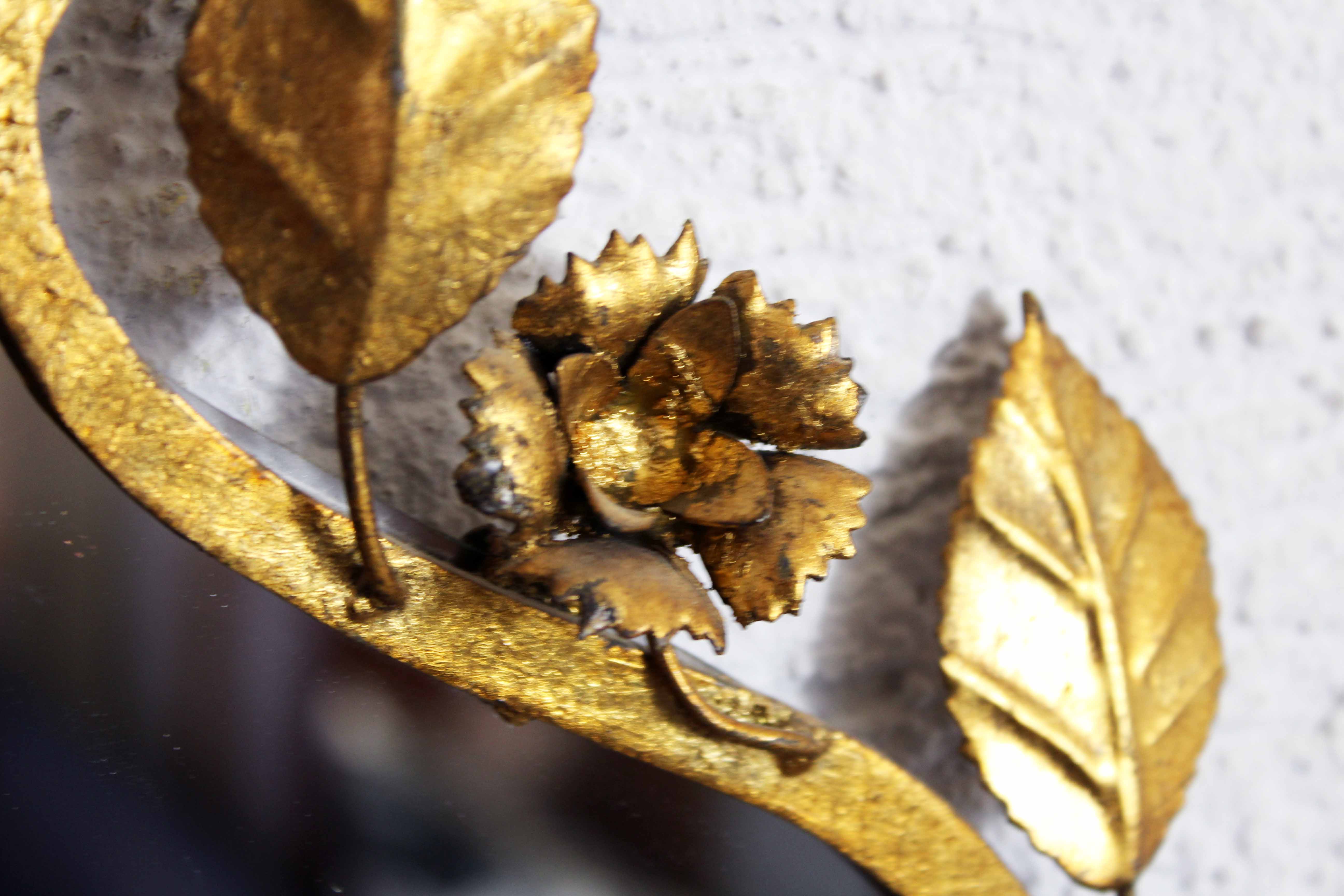 Old candlestick mirror gilded with leaf
