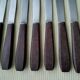 Set of 8 vintage stainless steel and brown bakelite table knives