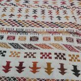 White carpet with multicolored Berber patterns
