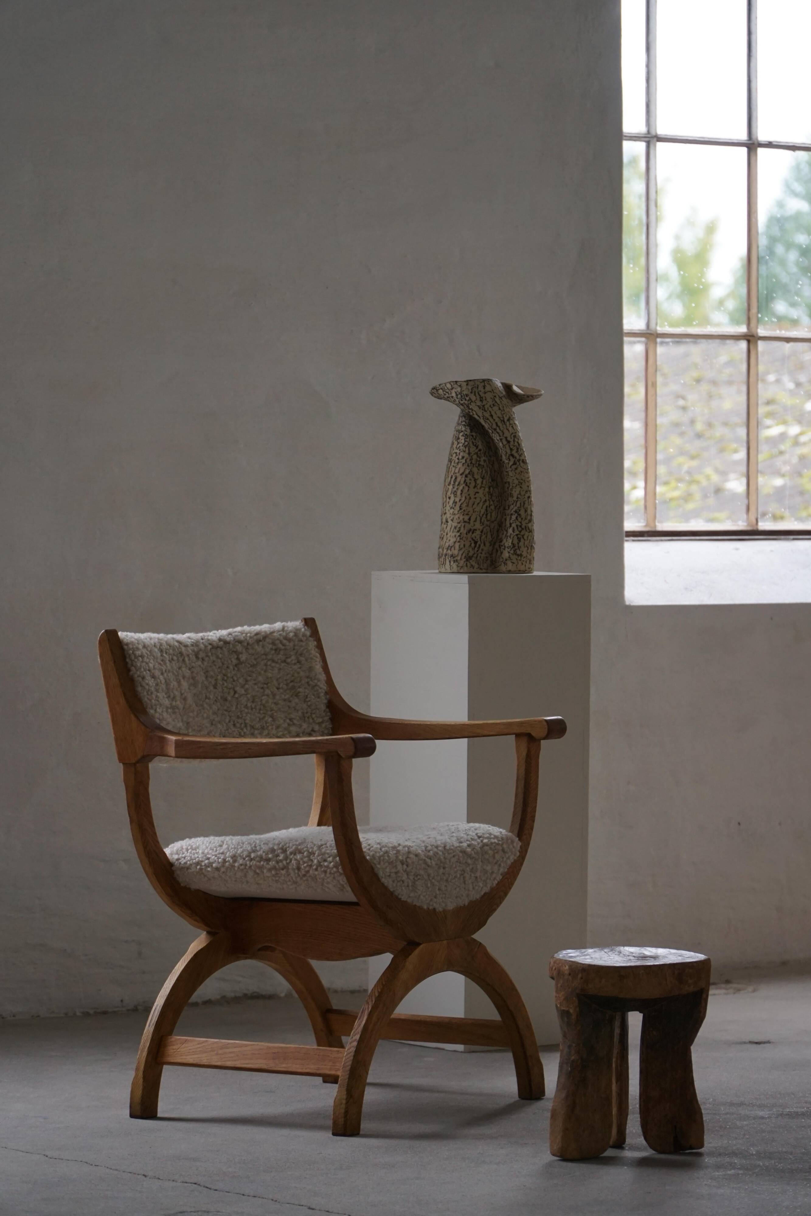 Henning Kjærnulf, Oak and lambswool armchair, "Kurul" model, Mid-century, 1960s