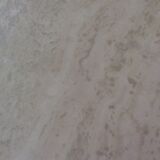 Octagonal coffee table in travertine