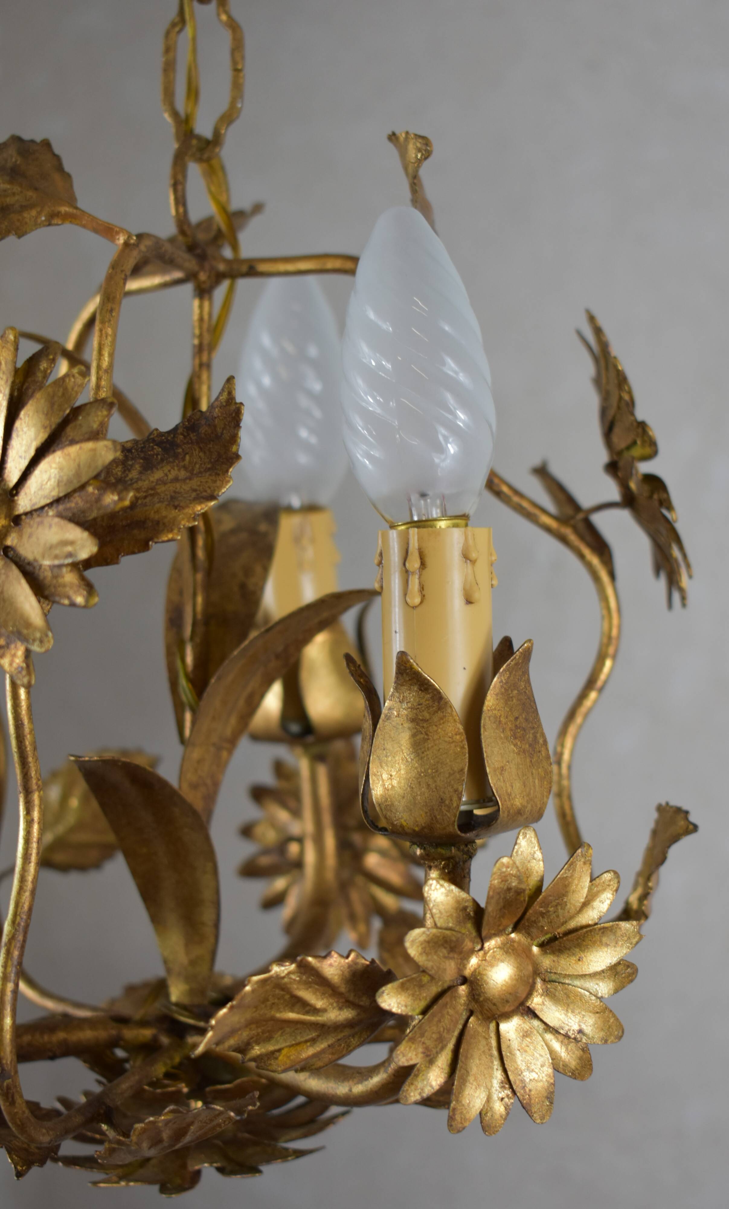 golden chandeliers with flowers.