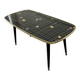 Table basse vintage en formica noir et or