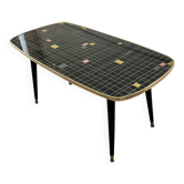 Table basse vintage en formica noir et or