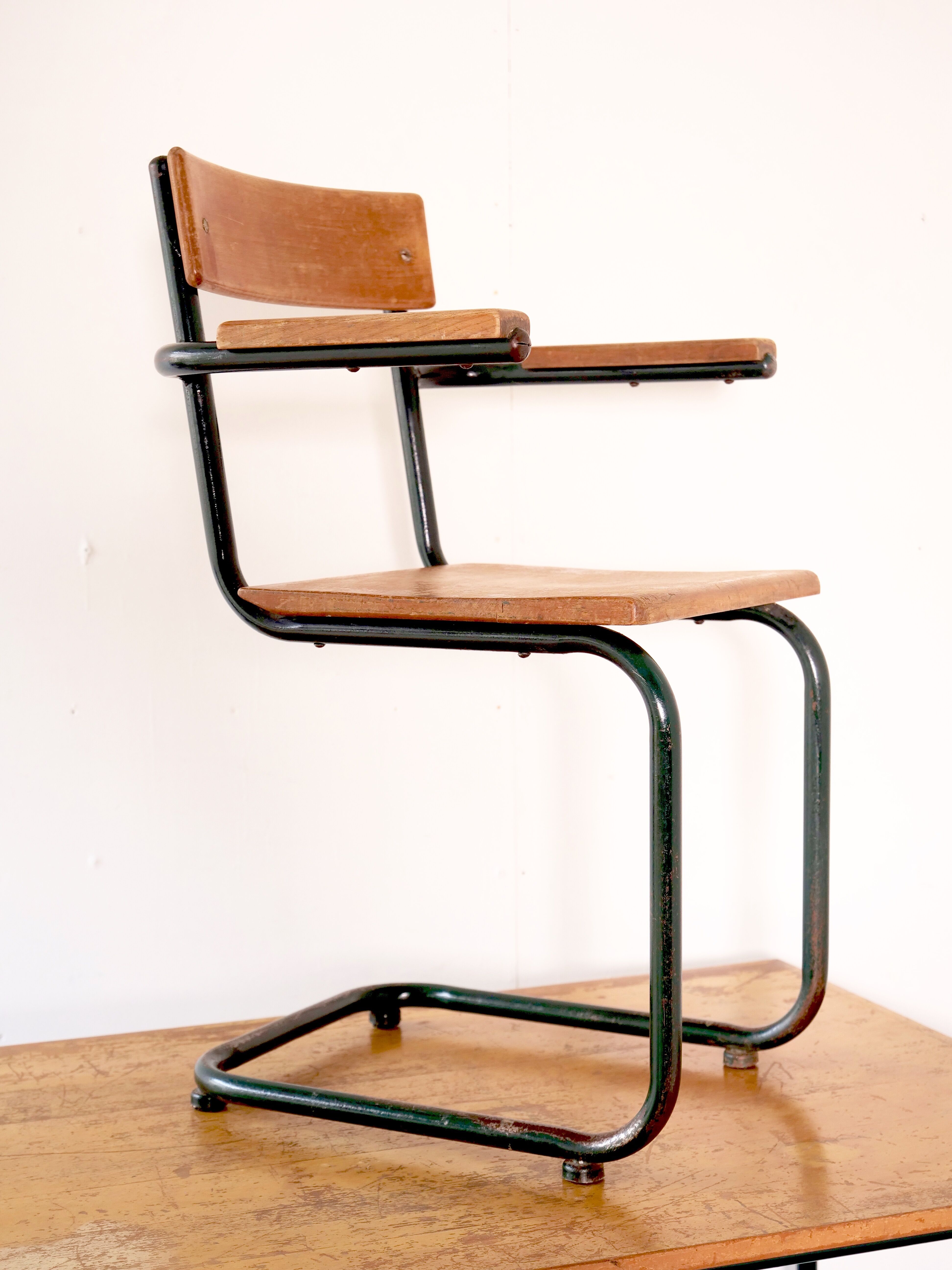 Desk with bauhaus style tubular steel chair