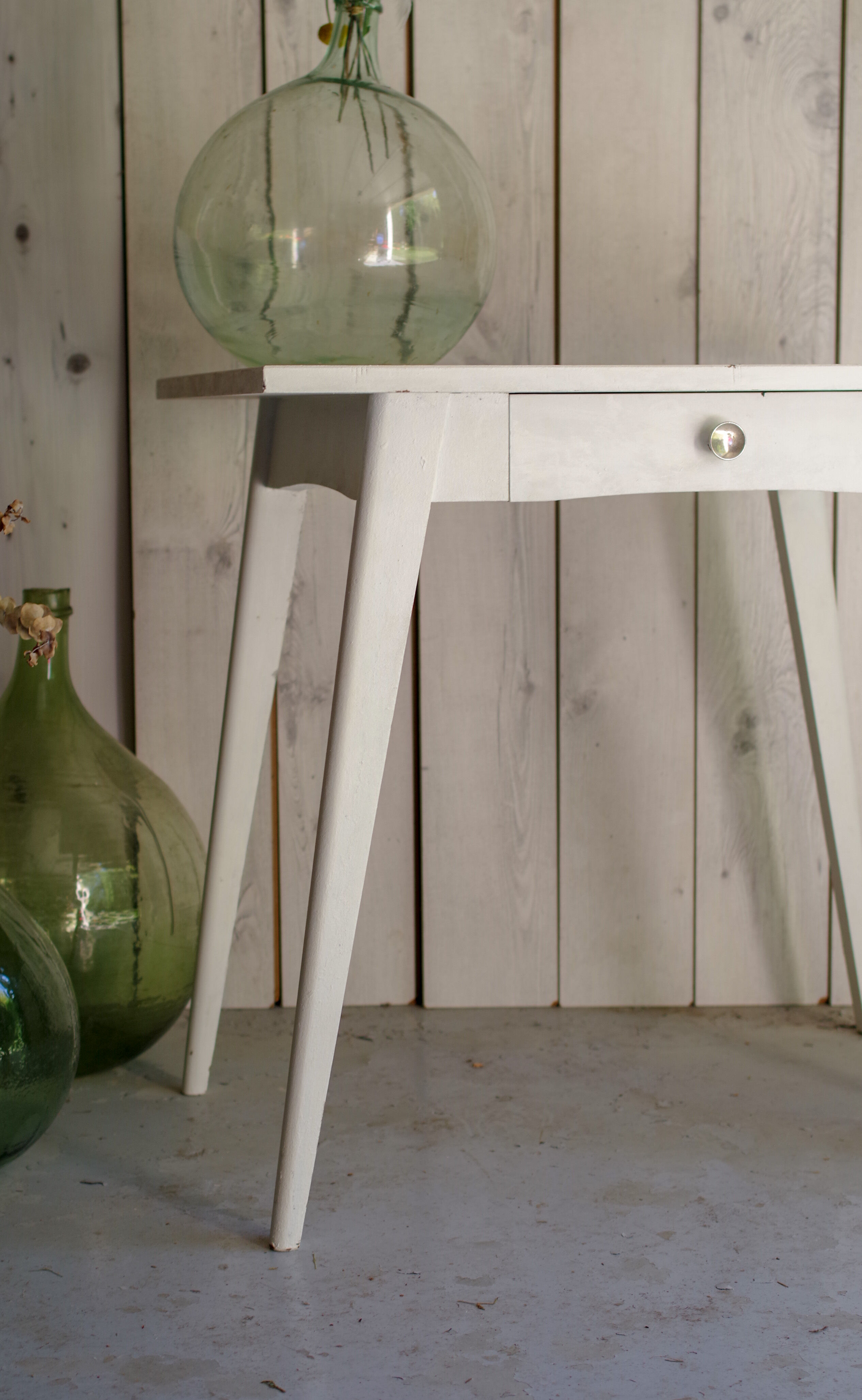 White compass feet table