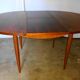 Round rosewood table with extension from the 70s
