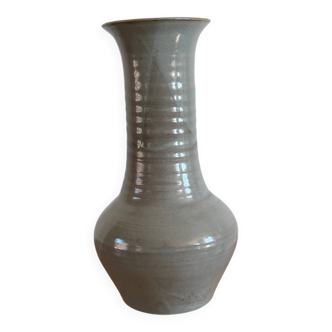 Glazed stoneware based, signed.