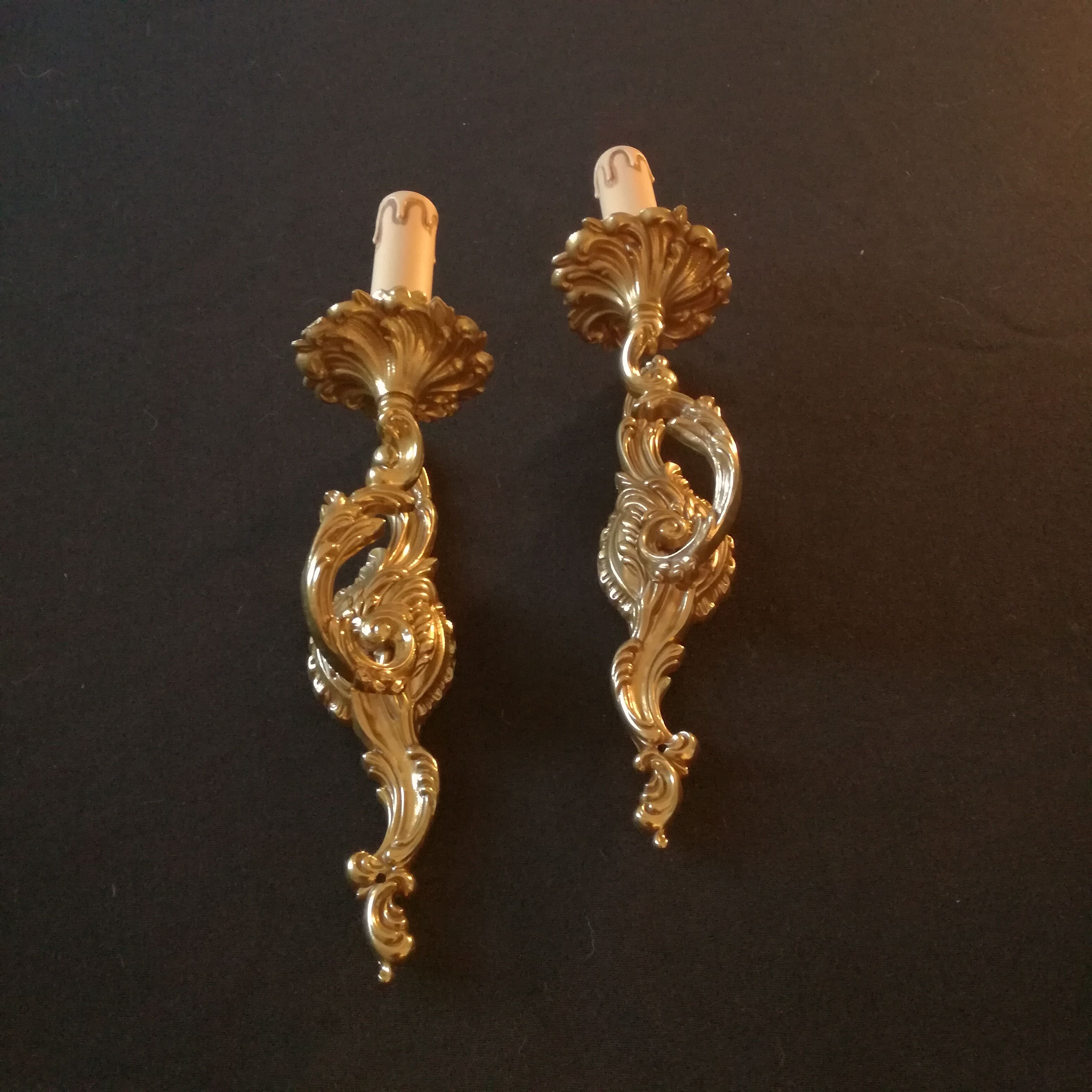 Pair of Louis XV wall lamps in bronze