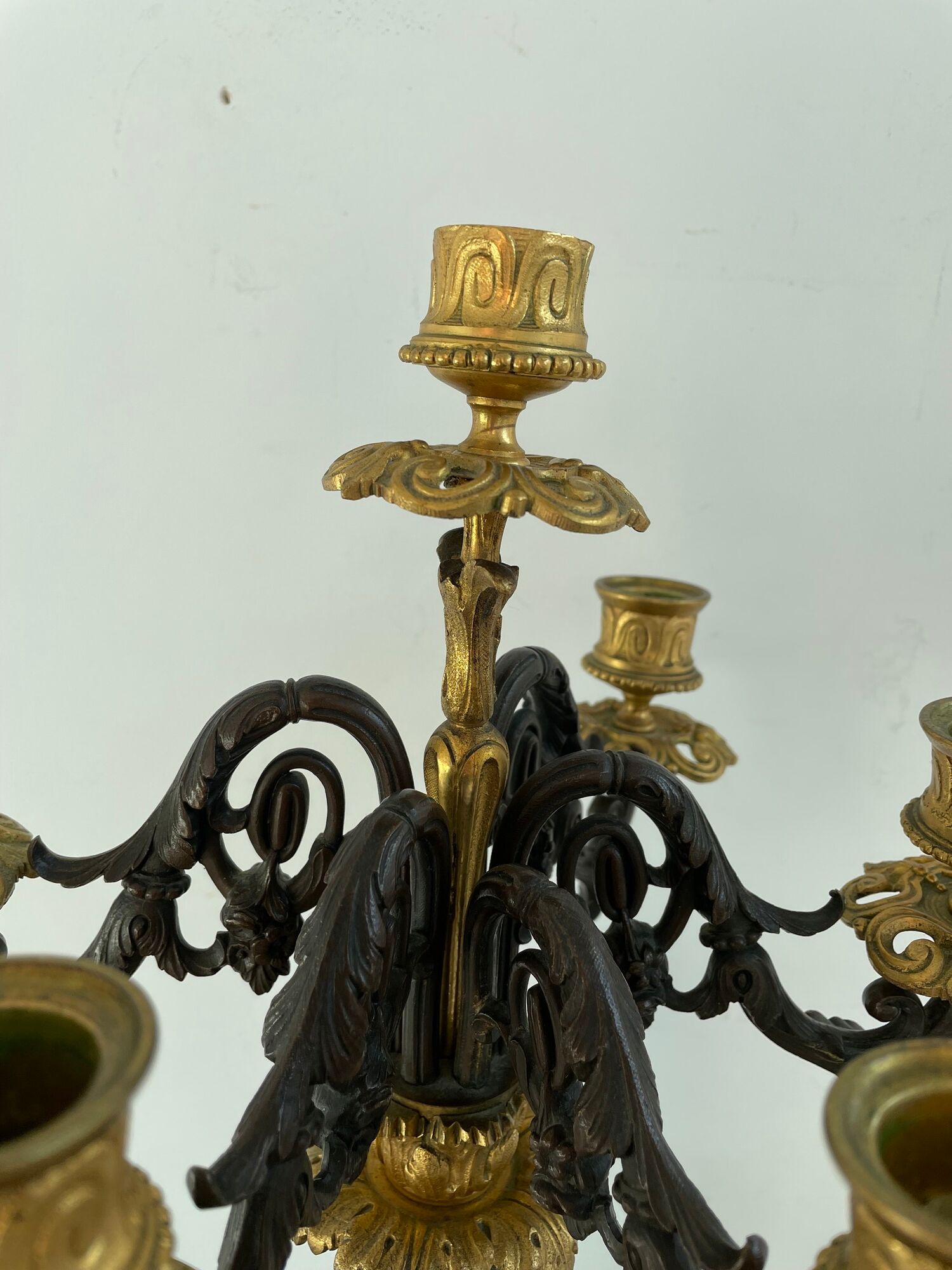 Candelabra with cherub in patinated bronze