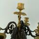 Candelabra with cherub in patinated bronze