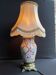 Old Asian vase mounted as a lamp with pagoda lampshade