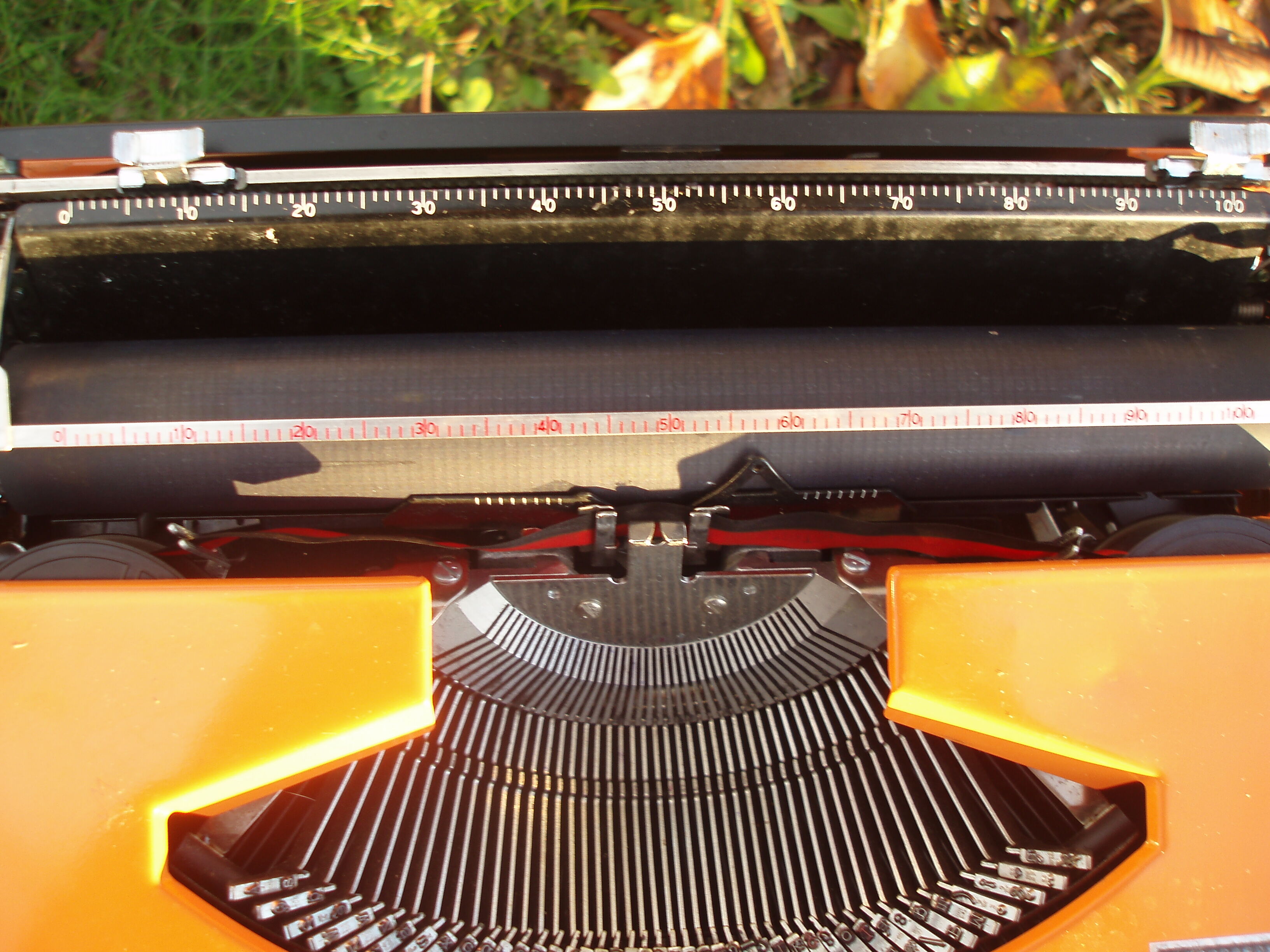 Silver reed orange and black typewriter with bag