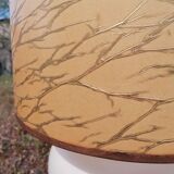 Vintage ceramic table lamp and golden lampshade.
