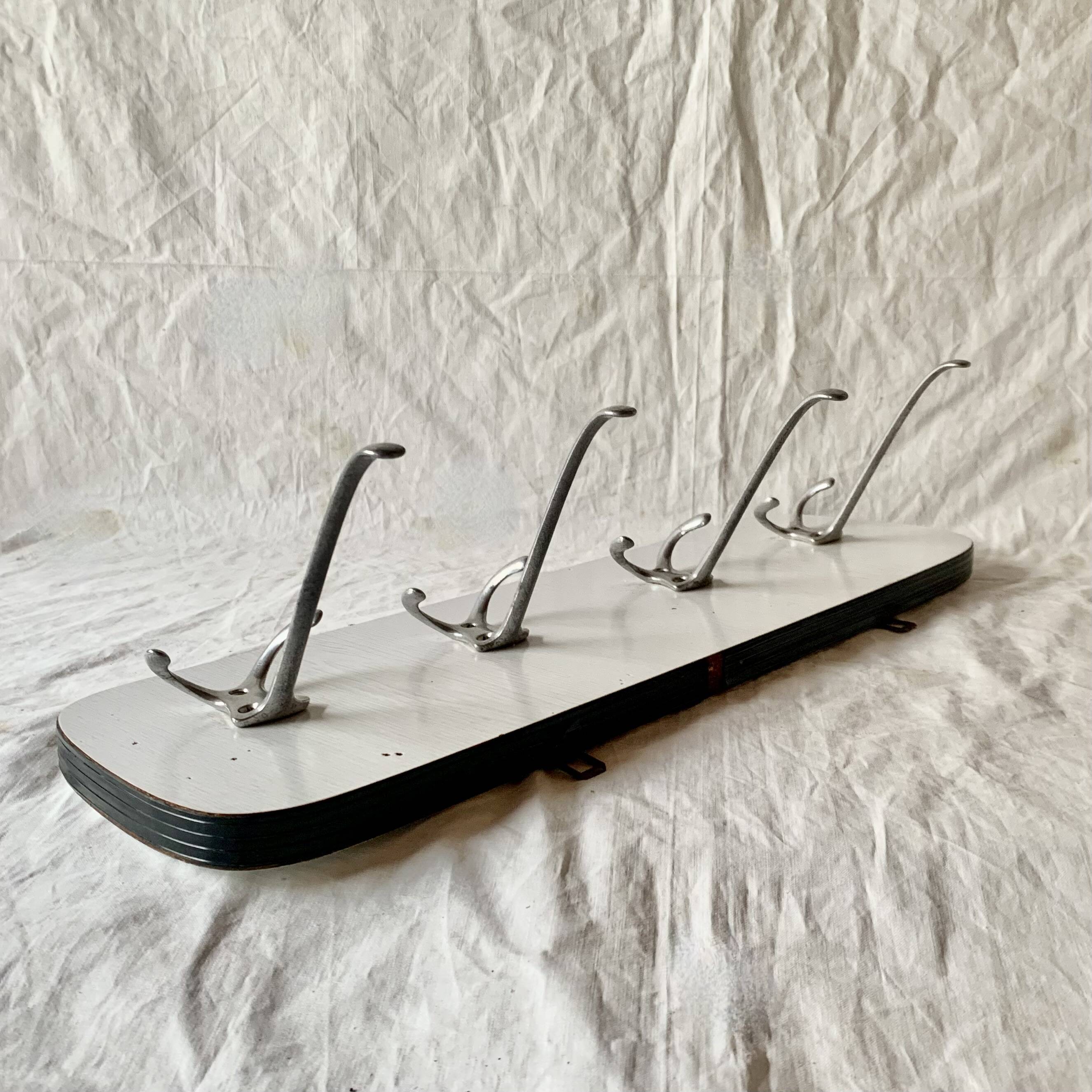 Vintage wall coat rack in white Formica - 4 cast aluminum coat hooks