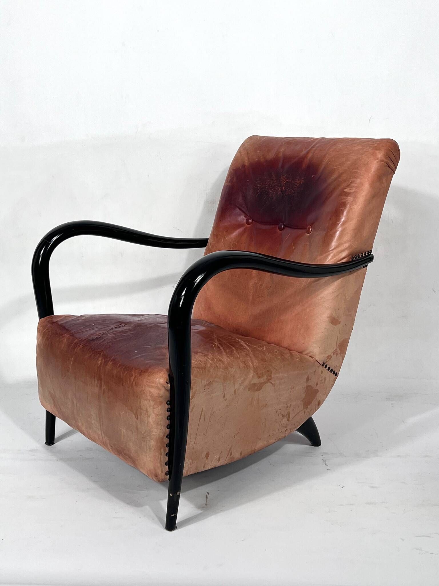 Sculptural Italian Mid-century leather and curved wood armchair from 50s
