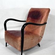 Sculptural Italian Mid-century leather and curved wood armchair from 50s