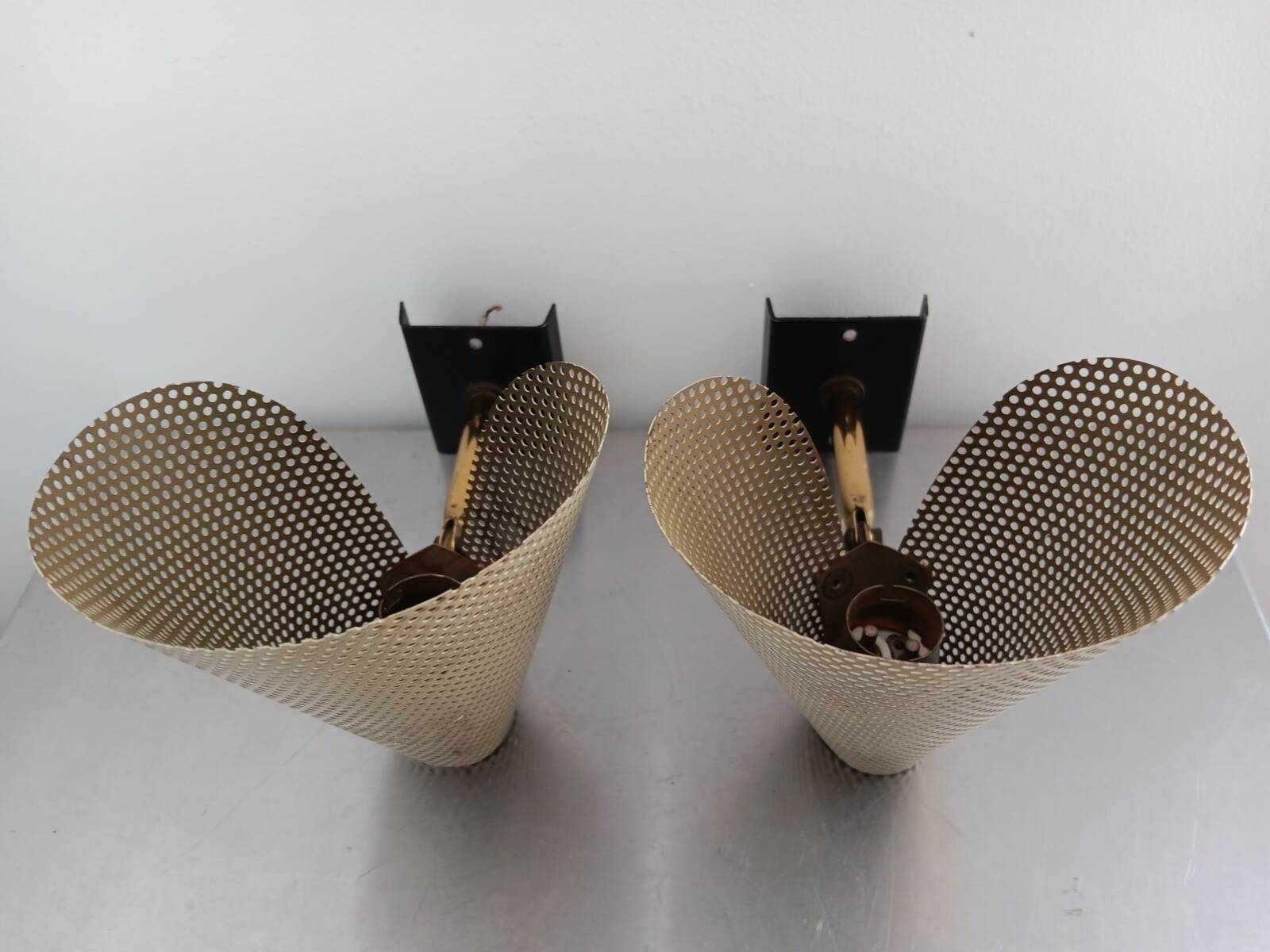 Pair of perforated metal horn wall lights