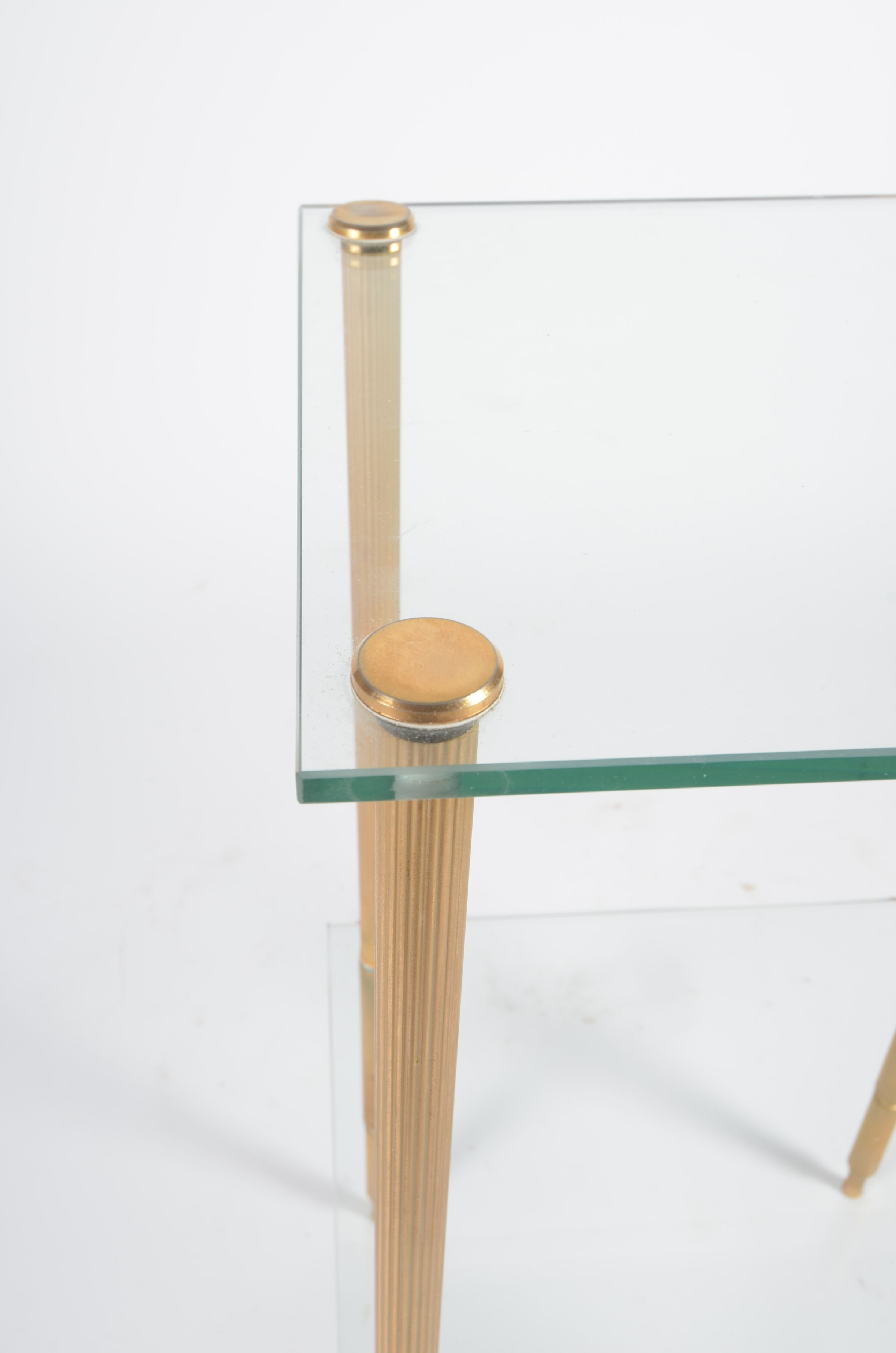 Glass and golden brass side table