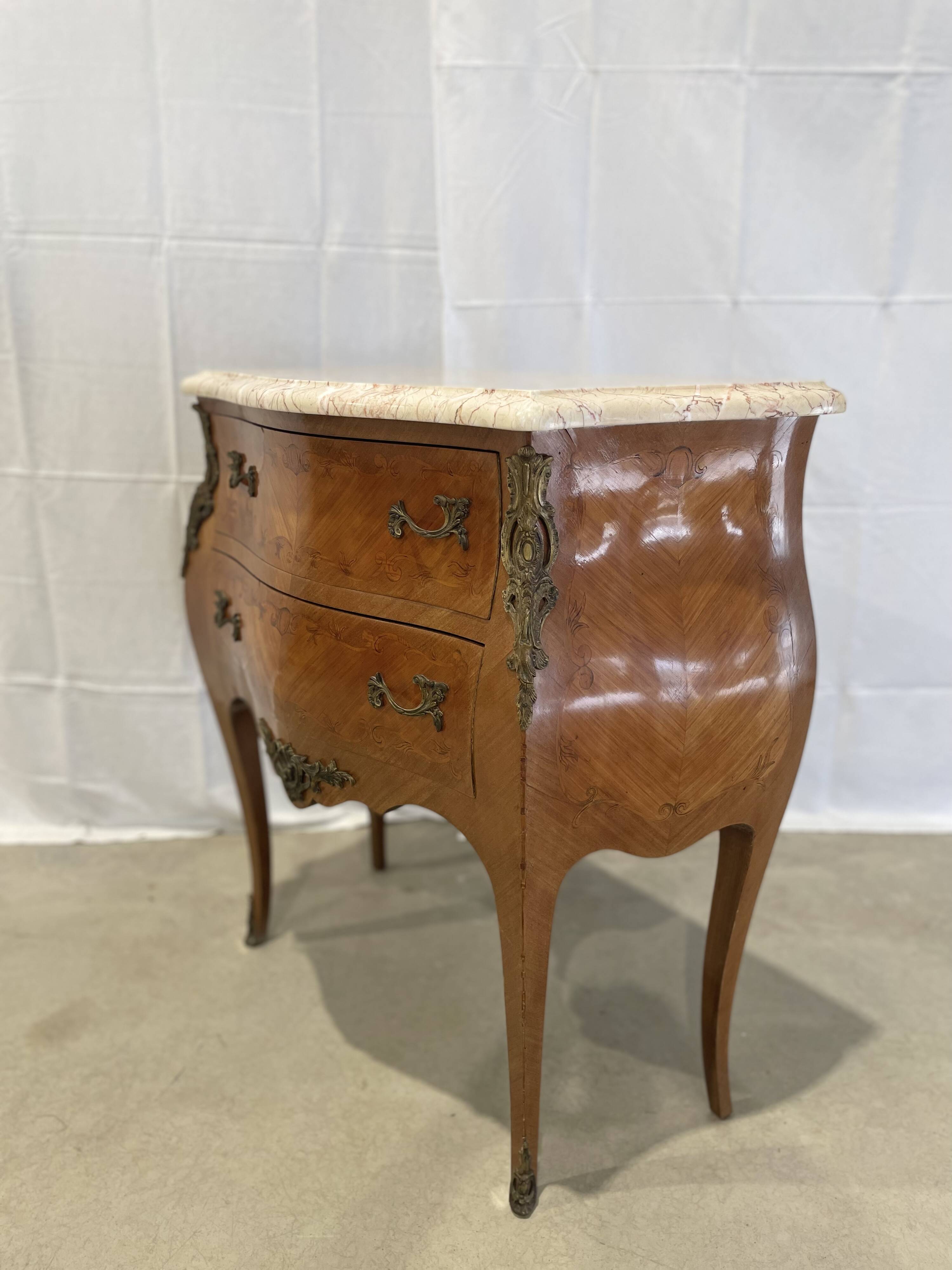 Old curved chest of drawers inlaid and marble Louis XV style