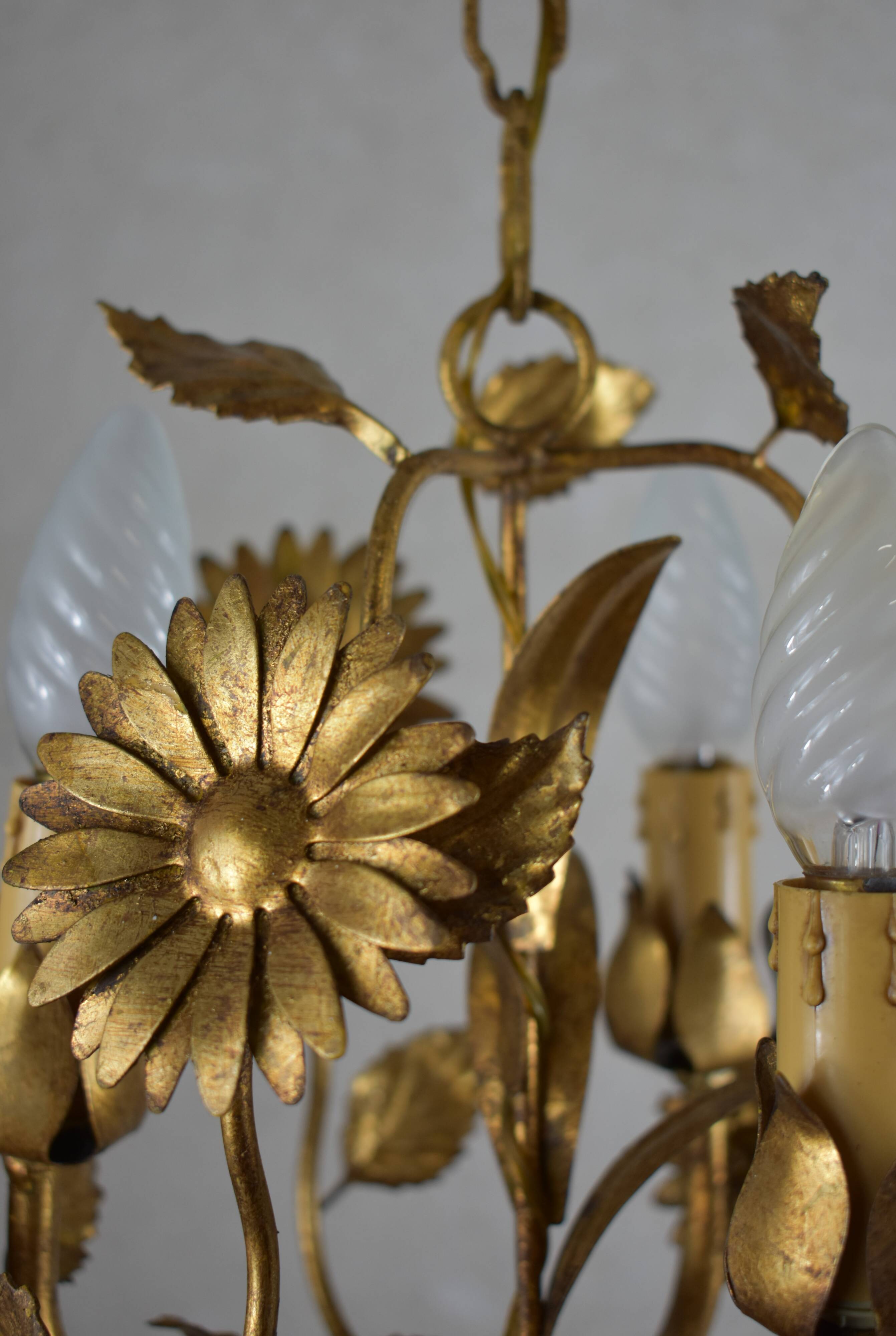 golden chandeliers with flowers.