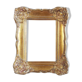 Patinated golden frame in wood and stucco