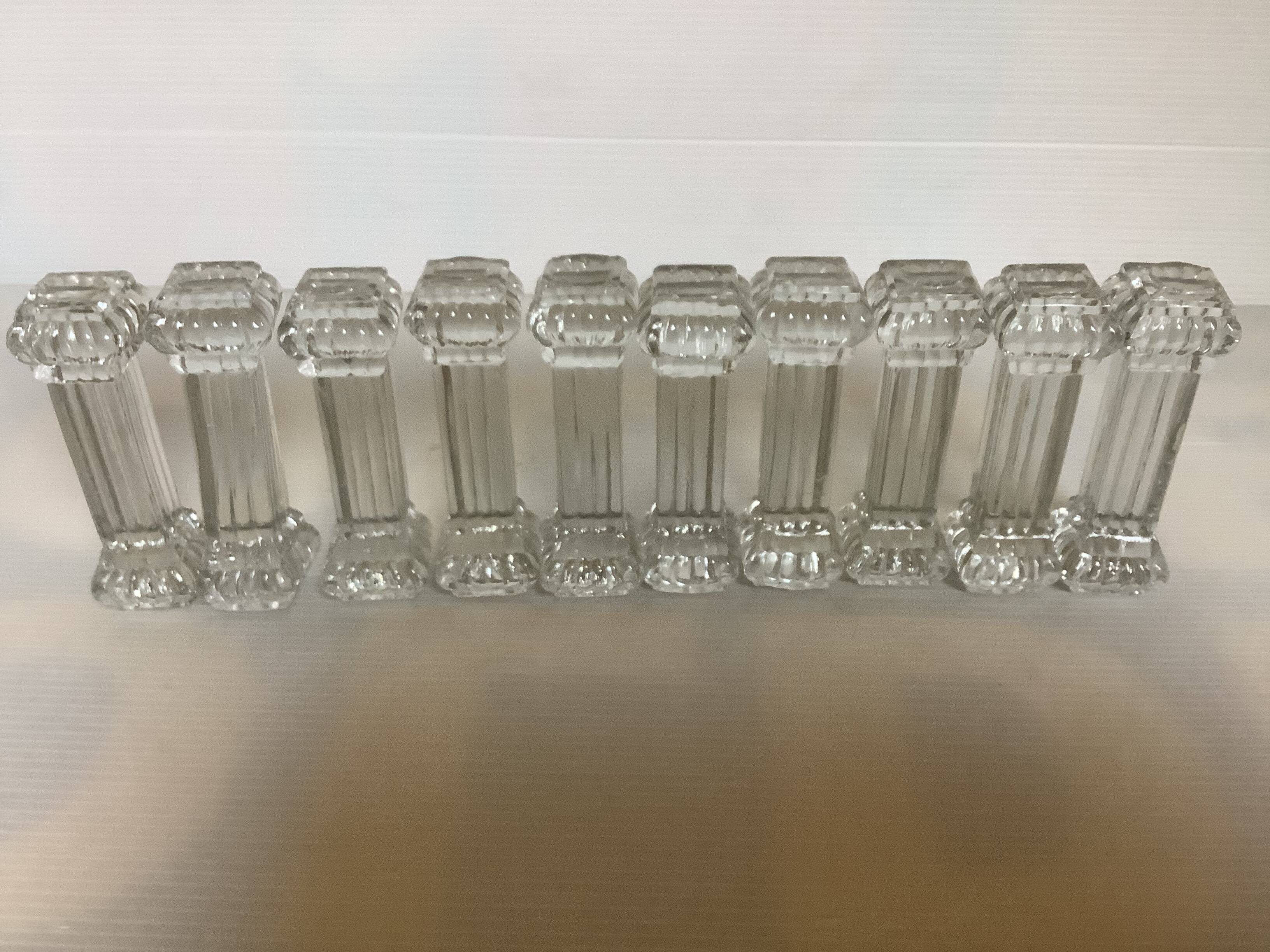 Ten old molded glass knife holders