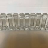 Ten old molded glass knife holders