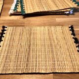 Braided placemats with pompoms