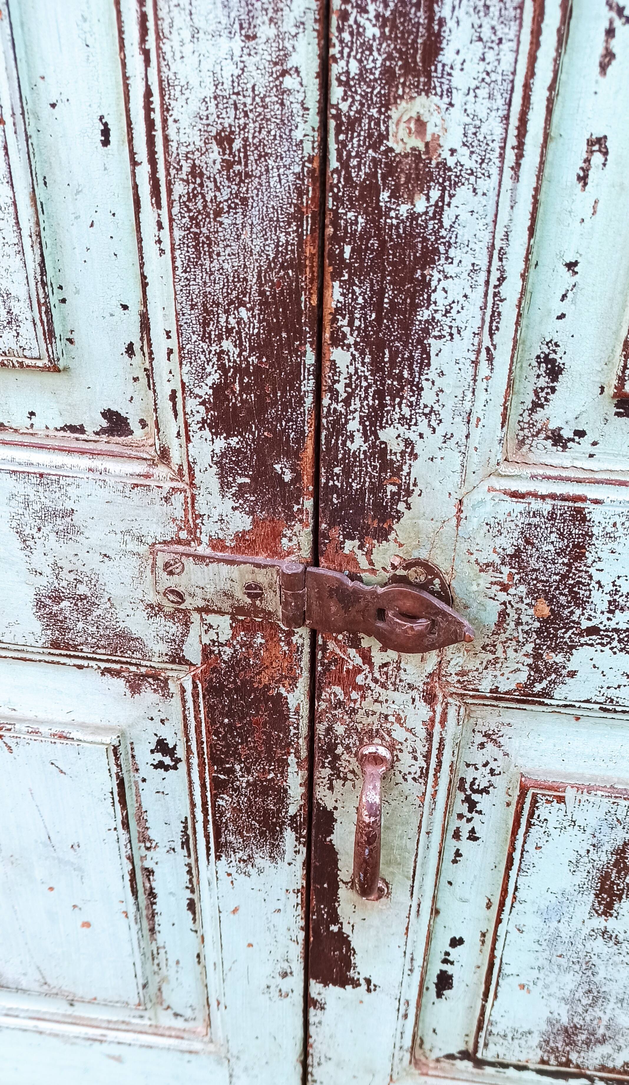 Old wooden cabinet with beautiful green patina