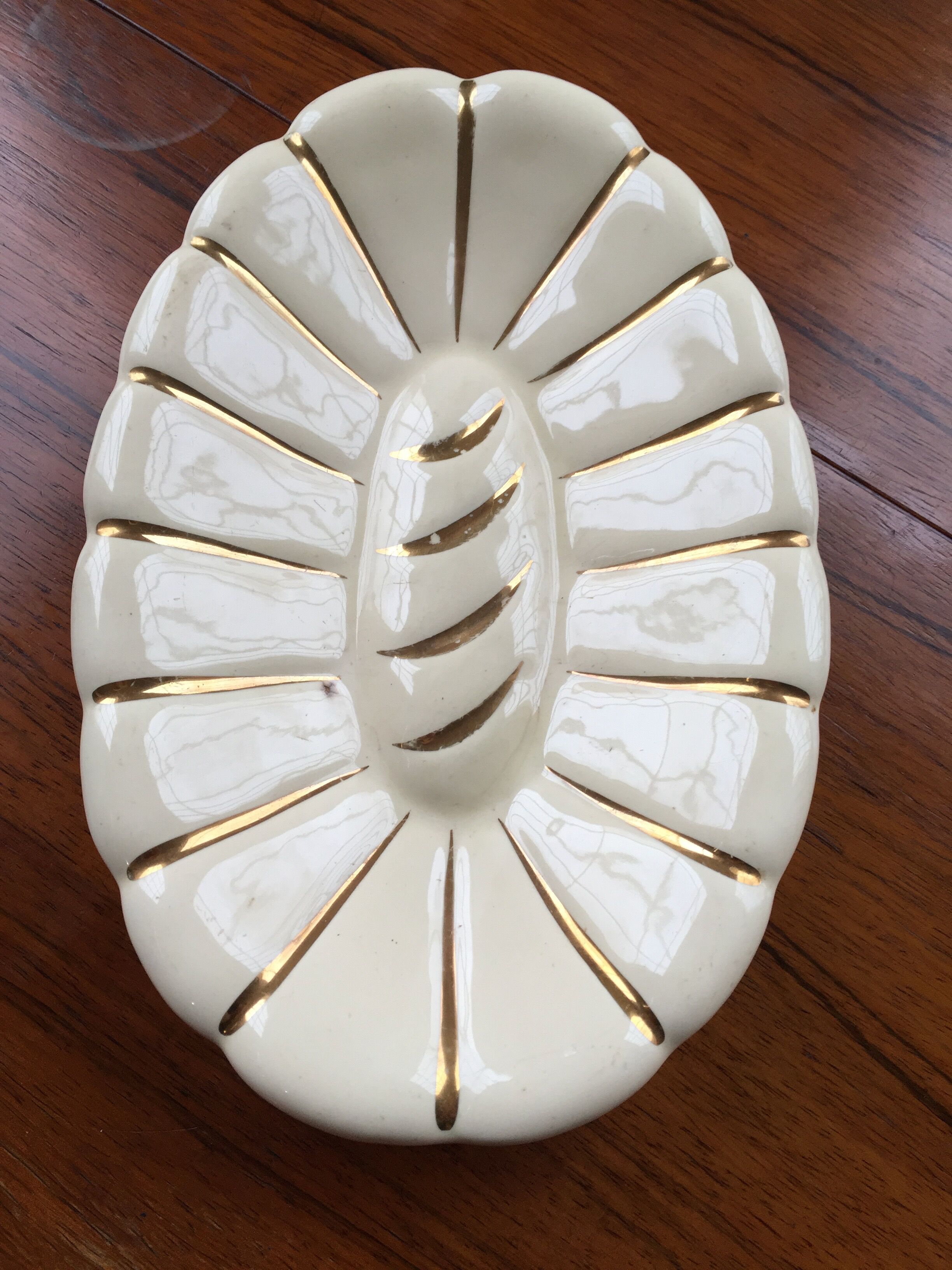 White and gold ceramic plate