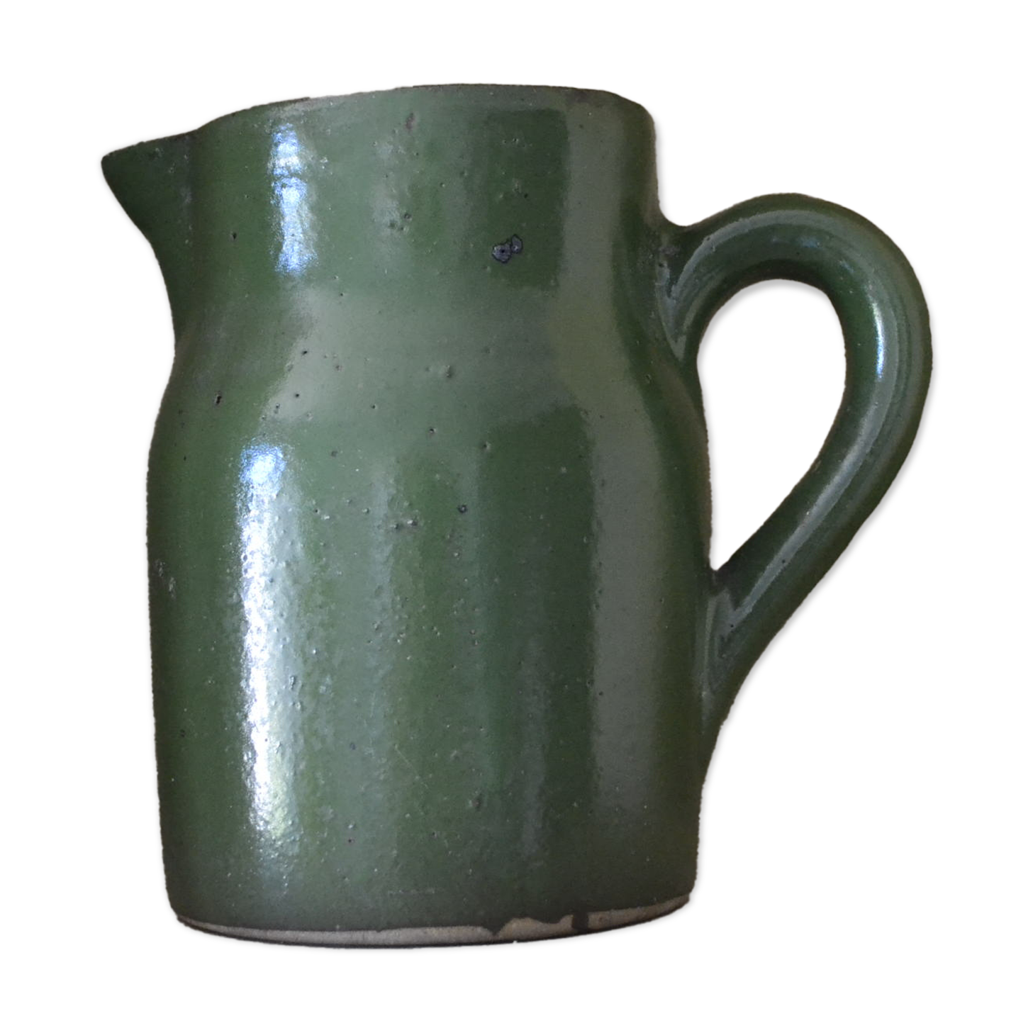 Green pitcher in sandstone