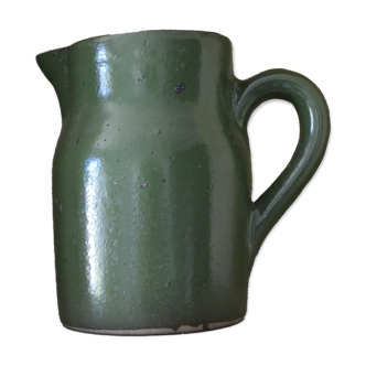 Green pitcher in sandstone