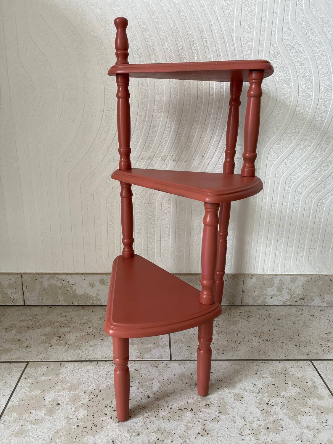 Old plant holder repainted in terracotta