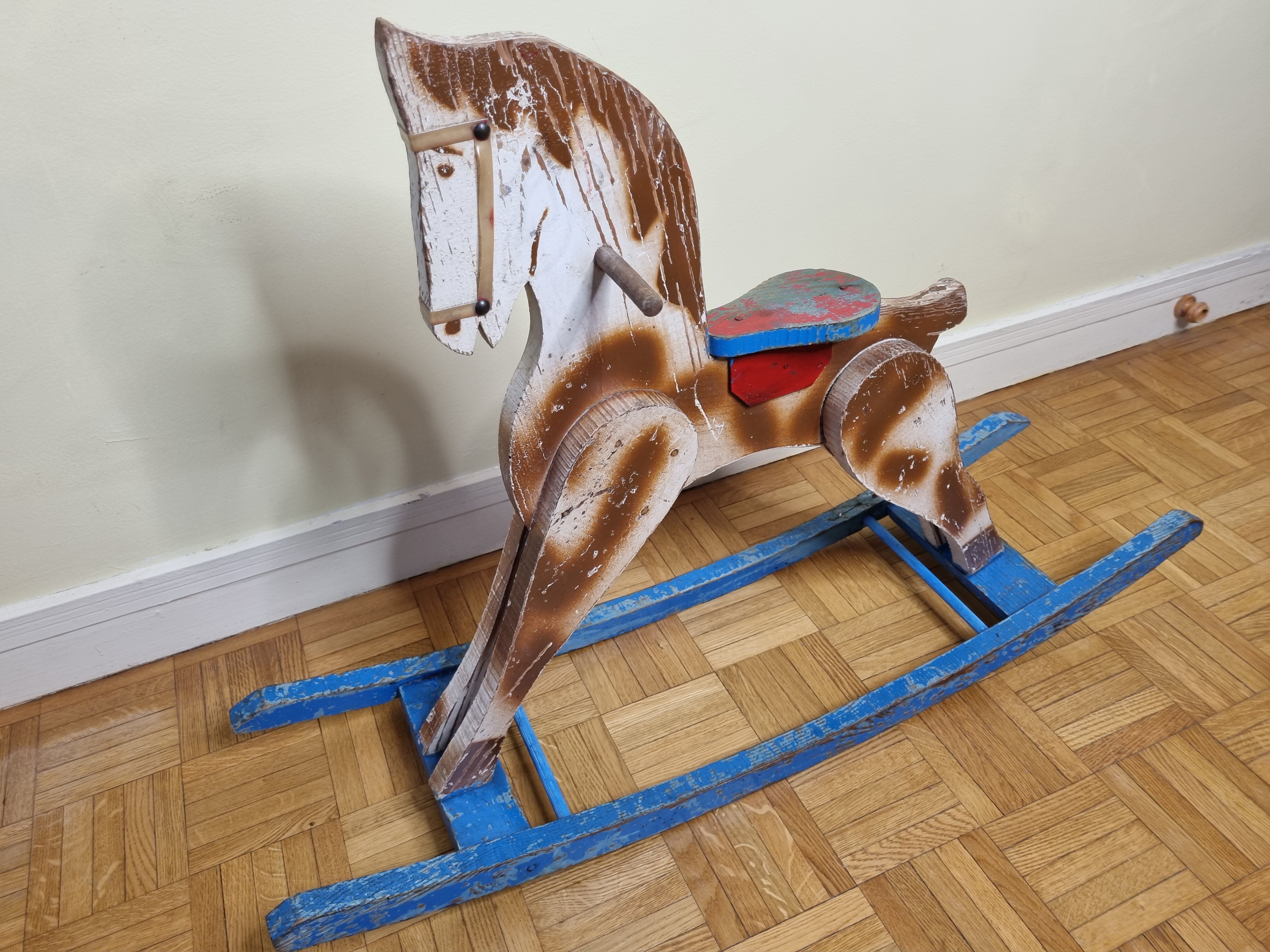 Old rocking horse in painted wood, 50s