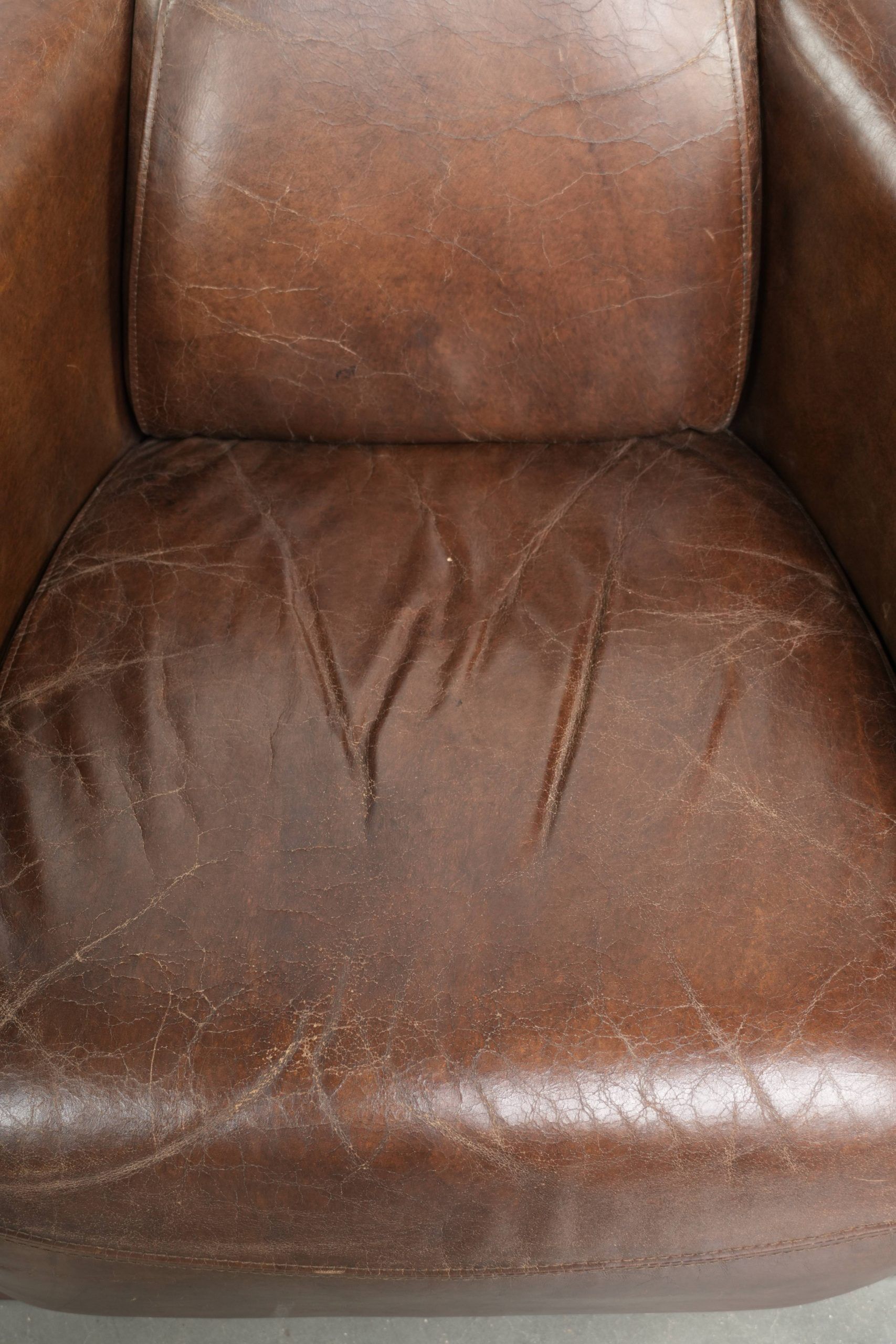 Sturdy dark cognac brown cow leather Aviator design armchair