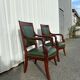 Paire de fauteuils de style Empire en acajou et cuir vert