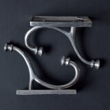 Pair of vintage cast aluminum coat hooks