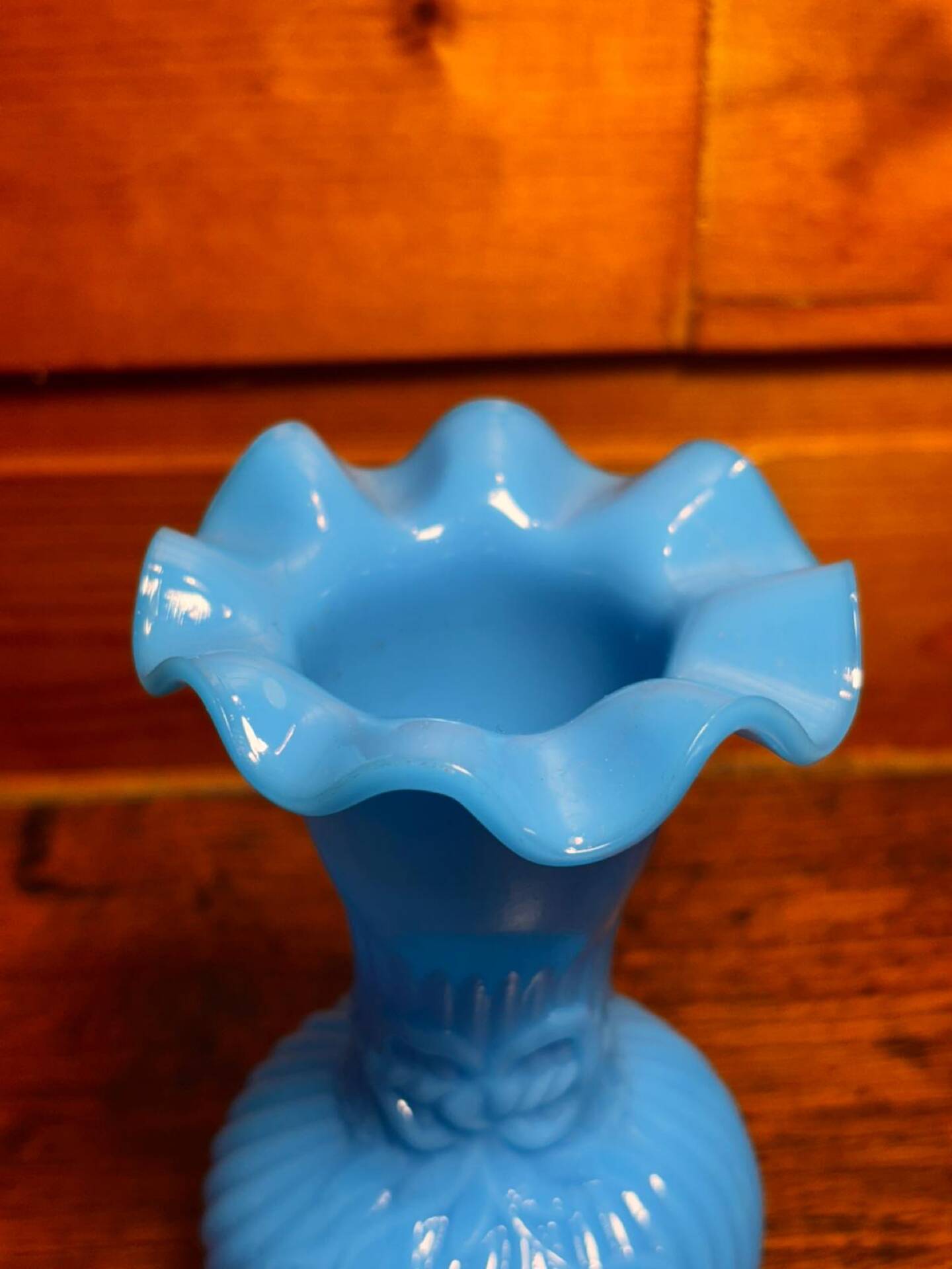 Blue opaline vase, opaque glass, wavy neck/rim, relief decoration of a bow.