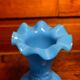 Blue opaline vase, opaque glass, wavy neck/rim, relief decoration of a bow.