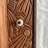 Old carved wooden medicine cabinet with beveled mirror