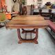 Art Deco extendable table in solid wood and brass.