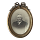 Oval medallion frame in wood and gilded stucco, Louis XVI style knot
