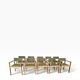 Vintage wooden chair with olive green seat and armrests.