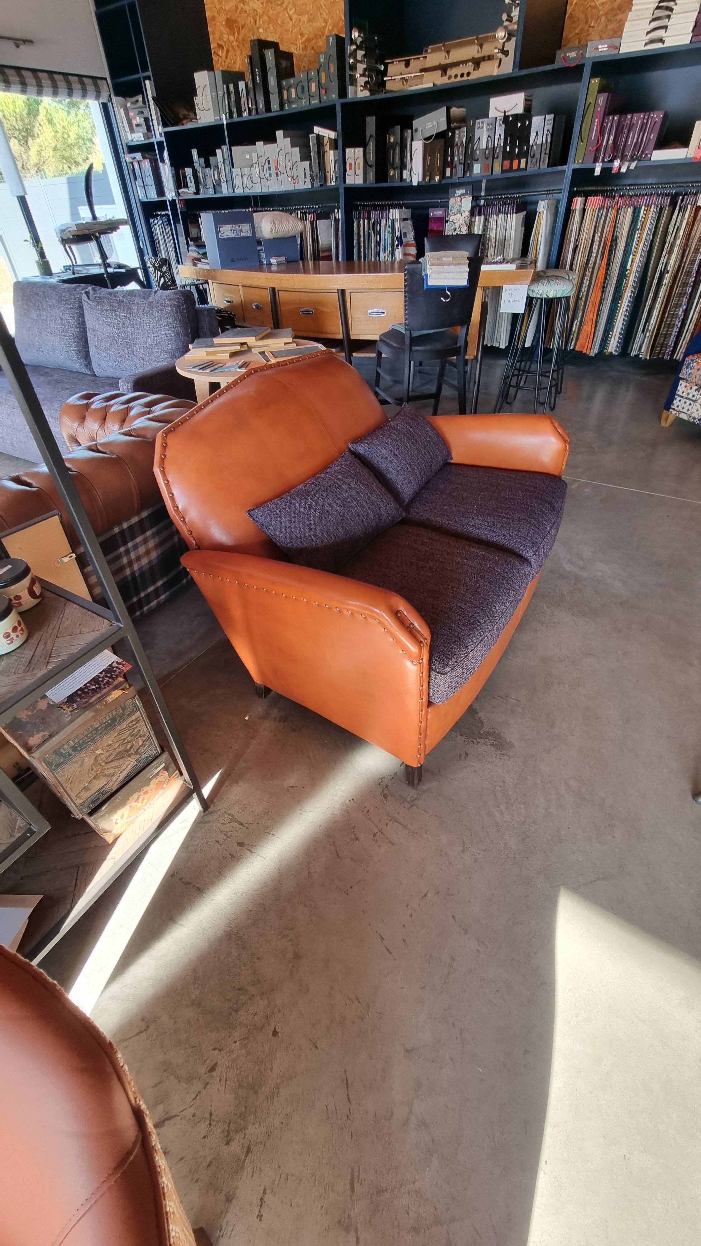 Club sofa in leather and fabric