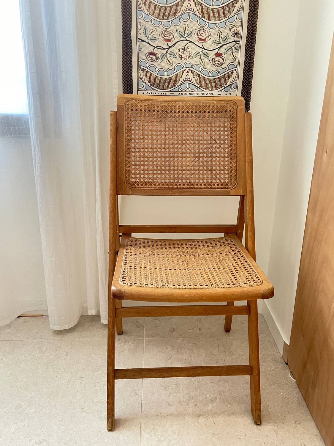Folding wooden and cane chair