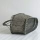 Woven metal wine basket