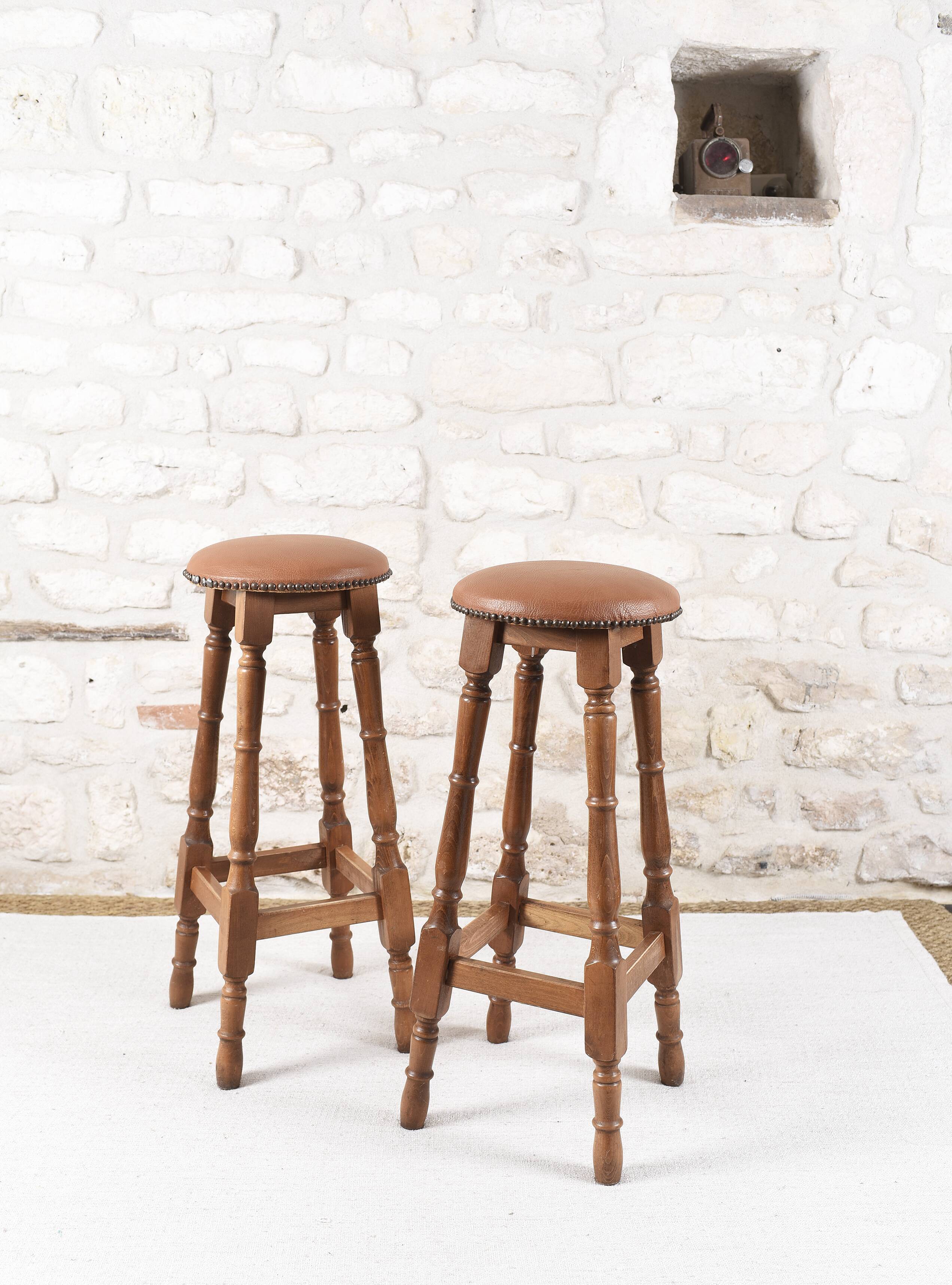 Antique bar stools, brown leather and wood