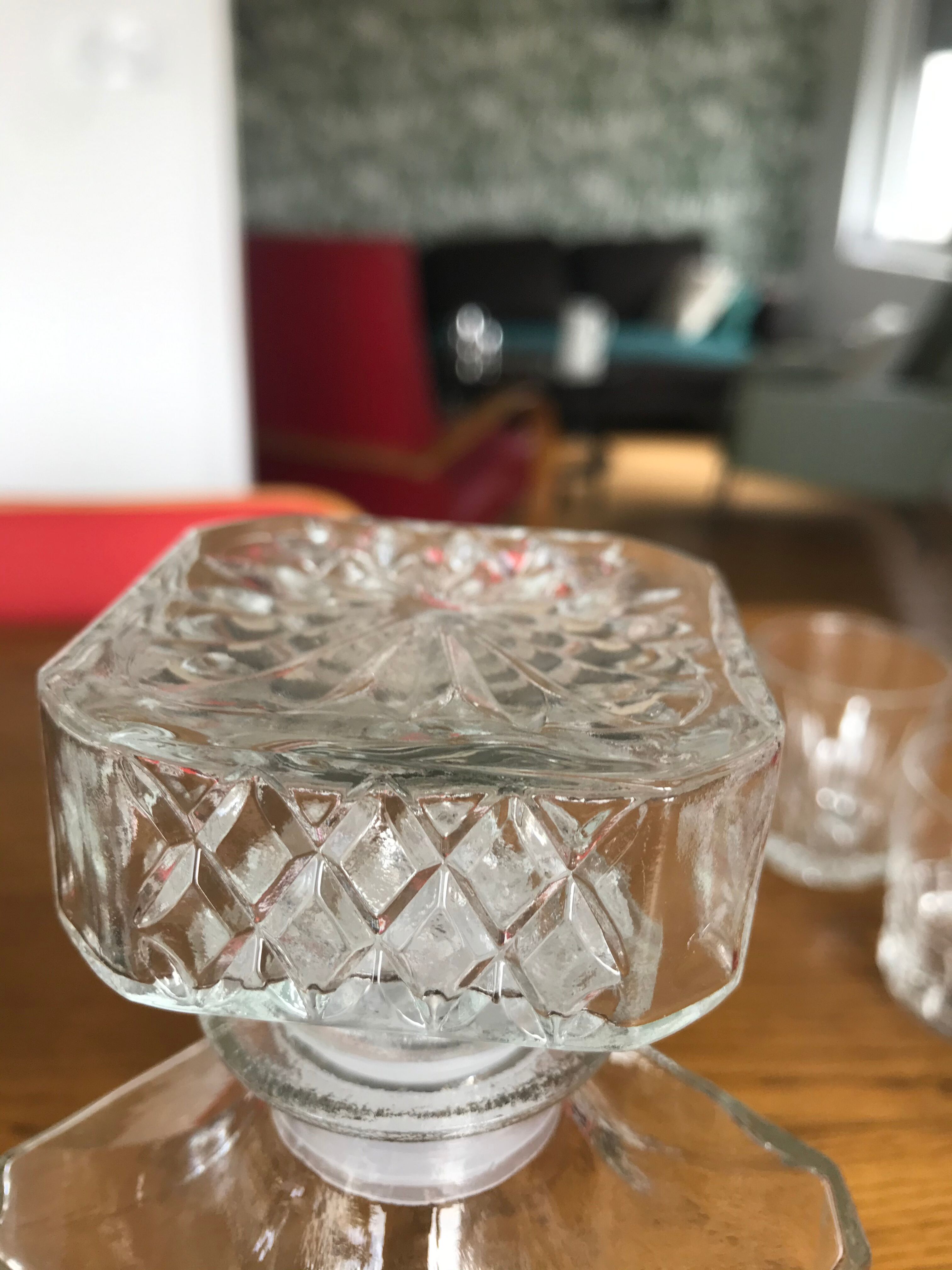 Mismatched decanter and whiskey glasses